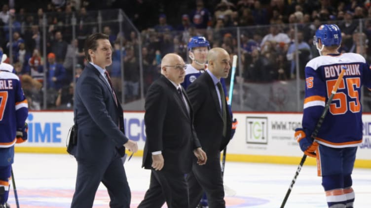 NEW YORK, NEW YORK - JANUARY 15: (l-r) Lane Lambert, Barry Trotz and Scott Gomez of the New York Islanders leave the ice following a win against the St. Louis Blues at the Barclays Center on January 15, 2019 in the Brooklyn borough of New York City. The Islanders defeated the Blues 2-1. (Photo by Bruce Bennett/Getty Images)