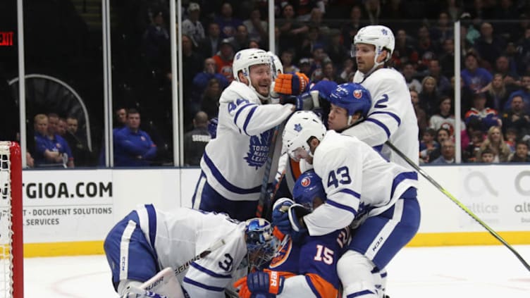 UNIONDALE, NEW YORK - APRIL 01: Nazem Kadri #43 of the Toronto Maple Leafs takes a second period roughing penalty against Cal Clutterbuck #15 of the New York Islanders at NYCB Live's Nassau Coliseum on April 01, 2019 in Uniondale, New York. (Photo by Bruce Bennett/Getty Images)