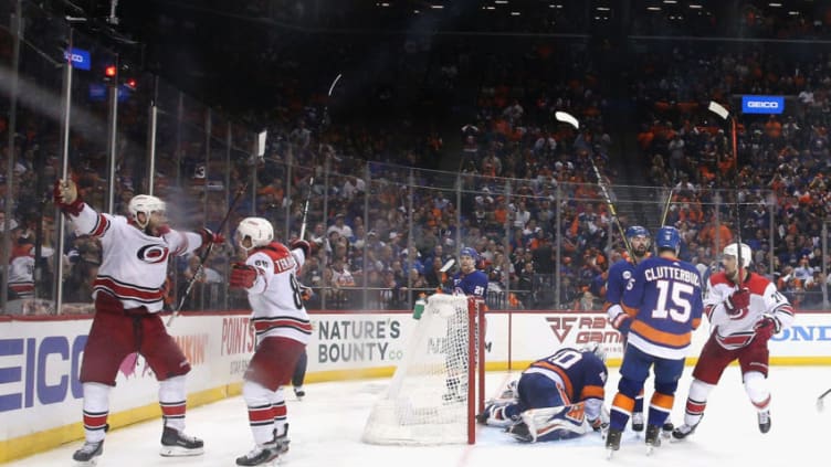 NEW YORK, NEW YORK - APRIL 26: Jordan Staal #11 of the Carolina Hurricanes (l) scores at 4:04 of overtime against the New York Islanders and is joined by Teuvo Teravainen #86 in Game One of the Eastern Conference Second Round during the 2019 NHL Stanley Cup Playoffs at the Barclays Center on April 26, 2019 in the Brooklyn borough of New York City. The Hurricanes defeated the islanders 1-0 in overtime. (Photo by Bruce Bennett/Getty Images)