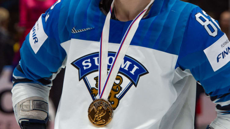 BRATISLAVA, SLOVAKIA - MAY 26: Feature of the gold medal on the neck of #82 Harri Pesonen of Finland after the 2019 IIHF Ice Hockey World Championship Slovakia final game between Canada and Finland at Ondrej Nepela Arena on May 26, 2019 in Bratislava, Slovakia. (Photo by RvS.Media/Monika Majer/Getty Images)