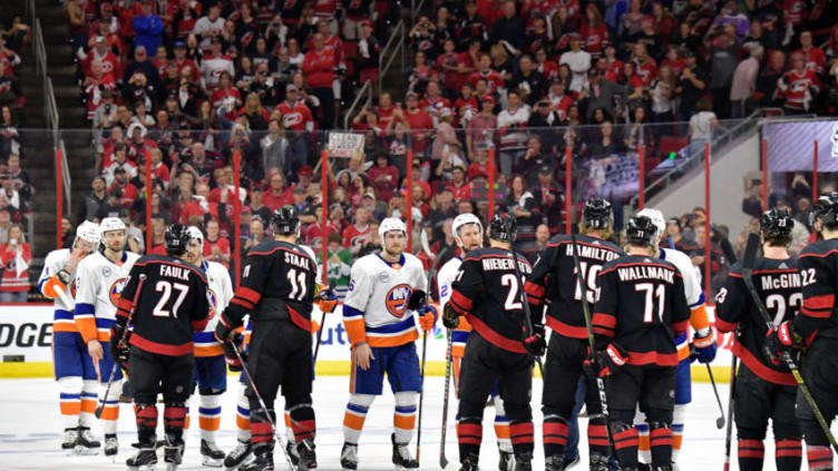 RALEIGH, NORTH CAROLINA - MAY 03: The Carolina Hurricanes and the New York Islanders shake hands after Game Four of the Eastern Conference Second Round during the 2019 NHL Stanley Cup Playoffs at PNC Arena on May 03, 2019 in Raleigh, North Carolina. The Hurricanes won 5-2 and won the series, 4-0. (Photo by Grant Halverson/Getty Images)