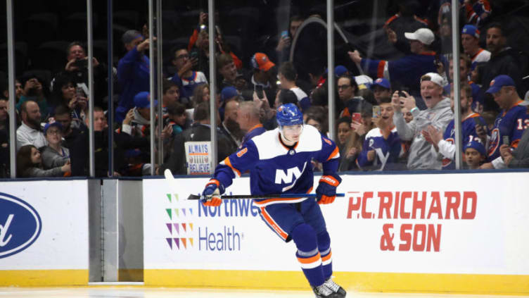 NEW YORK, NEW YORK - OCTOBER 08: Noah Dobson #8 of the New York Islanders leads the team out for warm-ups prior to playing in his first NHL game against the Edmonton Oilers at NYCB's LIVE Nassau Coliseum on October 08, 2019 in Uniondale, New York. As part of the rookie initiation, the rest of the team gives the player a few laps before they join him. (Photo by Bruce Bennett/Getty Images)