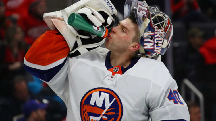 DETROIT, MICHIGAN - DECEMBER 02: Semyon Varlamov #40 of the New York Islanders takes a drink while playing the Detroit Red Wings at Little Caesars Arena on December 02, 2019 in Detroit, Michigan. (Photo by Gregory Shamus/Getty Images)