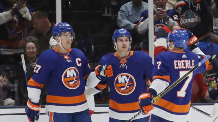 Anders Lee #27 of the New York Islanders and Mathew Barzal #13 (C) and Jordan Eberle #7 (R) (Photo by Bruce Bennett/Getty Images)