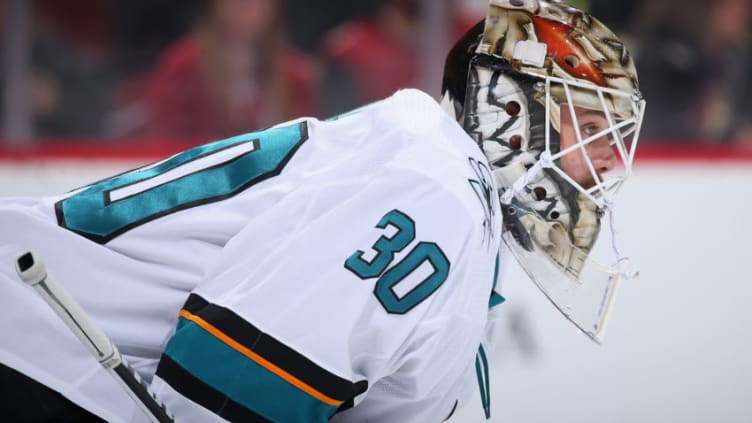 GLENDALE, ARIZONA - JANUARY 14: Goaltender Aaron Dell #30 of the San Jose Sharks looks down ice during the first period of the NHL game against the Arizona Coyotes at Gila River Arena on January 14, 2020 in Glendale, Arizona. (Photo by Christian Petersen/Getty Images)