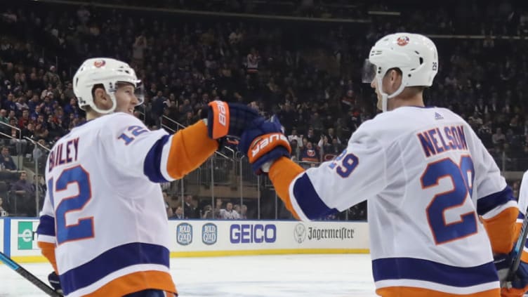 NEW YORK, NEW YORK - JANUARY 21: Brock Nelson #29 of the New York Islanders scores a third period goal against the New York Rangers and is joined by Josh Bailey #12 (L) at Madison Square Garden on January 21, 2020 in New York City. The Islanders defeated the Rangers 4-2. (Photo by Bruce Bennett/Getty Images)