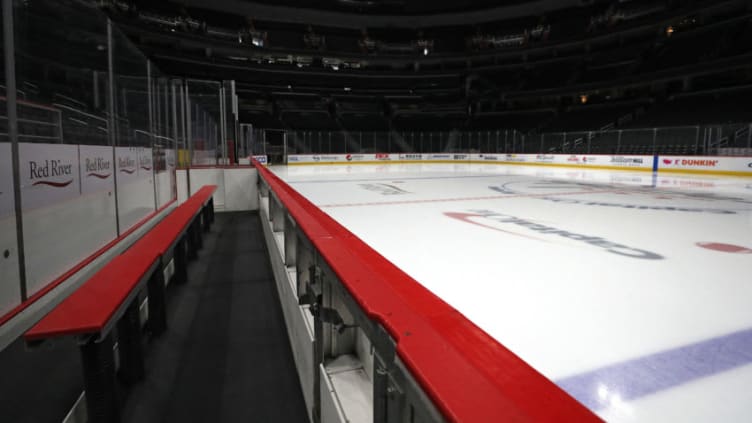 WASHINGTON, DC - MARCH 12: The ice, player's bench, and spectator seating are empty prior to the Detroit Red Wings playing against the Washington Capitals at Capital One Arena on March 12, 2020 in Washington, DC. Yesterday, the NBA suspended their season until further notice after a Utah Jazz player tested positive for the coronavirus (COVID-19). The NHL said per a release, that the uncertainty regarding next steps regarding the coronavirus, Clubs were advised not to conduct morning skates, practices or team meetings today. (Photo by Patrick Smith/Getty Images)