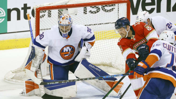 SUNRISE, FL - OCTOBER 16: Sam Reinhart #13 of the Florida Panthers is unable to get the rebound given up by goaltender Ilya Sorokin #30 of the New York Islanders at the FLA Live Arena on October 16, 2021 in Sunrise, Florida. (Photo by Joel Auerbach/Getty Images)