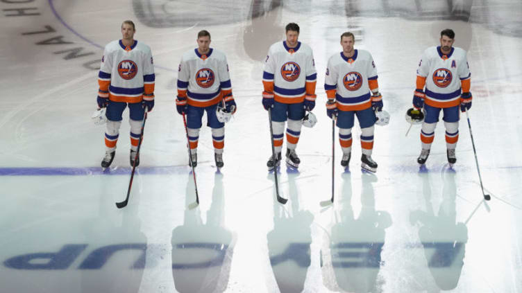 The New York Islanders stand at attention during the national anthems (Photo by Andre Ringuette/Freestyle Photo/Getty Images)