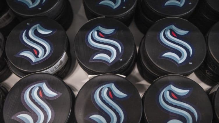 SEATTLE, WASHINGTON - AUGUST 21: Pucks advertise the NHL's newest franchise during the grand opening of Seattle Kraken Team Store on August 21, 2020 in Seattle, Washington. (Photo by Jim Bennett/Getty Images)