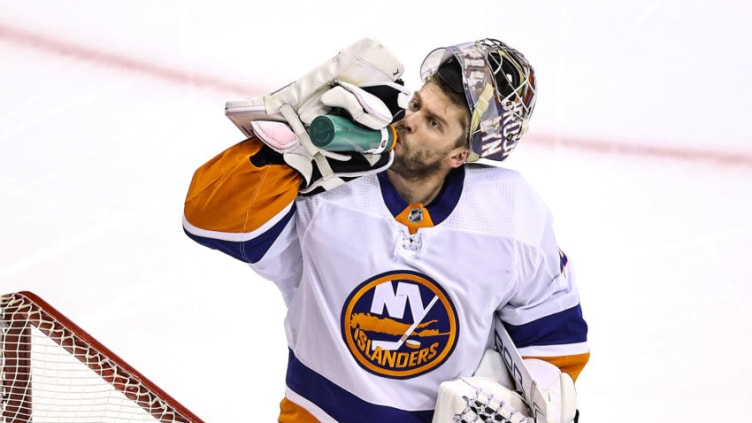 TORONTO, ONTARIO - AUGUST 26: Semyon Varlamov #40 of the New York Islanders grabs a drink prior to Game Two of the Eastern Conference Second Round against the Philadelphia Flyers during the 2020 NHL Stanley Cup Playoffs at Scotiabank Arena on August 26, 2020 in Toronto, Ontario. (Photo by Elsa/Getty Images)