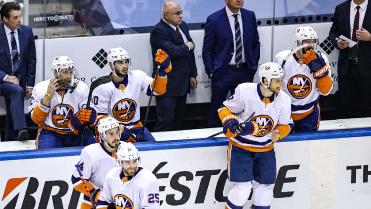 The New York Islanders reacts after their 4-3 (Photo by Elsa/Getty Images)