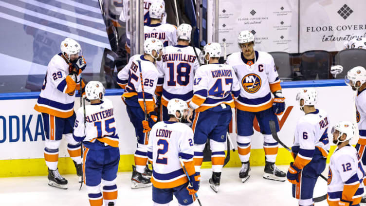 The New York Islanders reacts after their 4-3 overtime loss (Photo by Elsa/Getty Images)