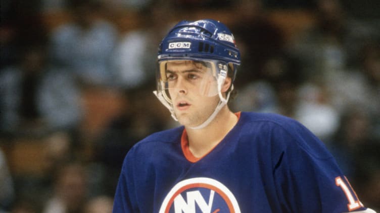 EAST RUTHERFORD, NJ - CIRCA 1988: Pat LaFontaine #16 of the New York Islanders skates against the New Jersey Devils during an NHL Hockey game circa 1988 at the Brendan Byrne Arena in East Rutherford, New Jersey. LaFontaine's playing career went from 1983-98. (Photo by Focus on Sport/Getty Images)