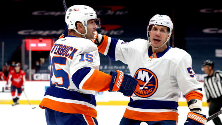 WASHINGTON, DC - JANUARY 28: Cal Clutterbuck #15 of the New York Islanders celebrates his first period goal with Casey Cizikas #53 against the Washington Capitals at Capital One Arena on January 28, 2021 in Washington, DC. (Photo by Rob Carr/Getty Images)