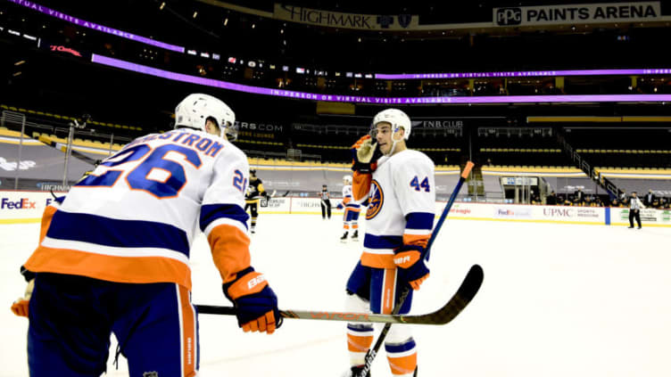 PITTSBURGH, PENNSYLVANIA - FEBRUARY 18: Jean-Gabriel Pageau #44 and Oliver Wahlstrom #26 of the New York Islanders during their game against the Pittsburgh Penguins at PPG PAINTS Arena on February 18, 2021 in Pittsburgh, Pennsylvania. (Photo by Emilee Chinn/Getty Images)