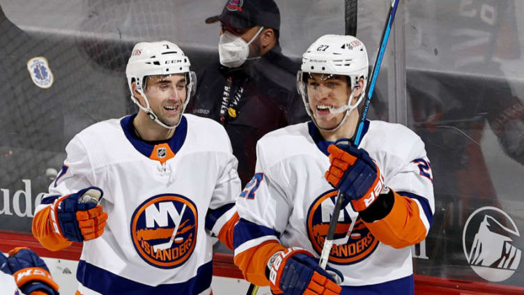 NEWARK, NEW JERSEY - MARCH 02: Anders Lee #27 of the New York Islanders celebrates his game winning goal with Jordan Eberle #7 in the third period against the New Jersey Devils at Prudential Center on March 02, 2021 in Newark, New Jersey.Due to COVID-19 restrictions a limited number of fans are allowed to attend. The New York Islanders defeated the New Jersey Devils 2-1. (Photo by Elsa/Getty Images)