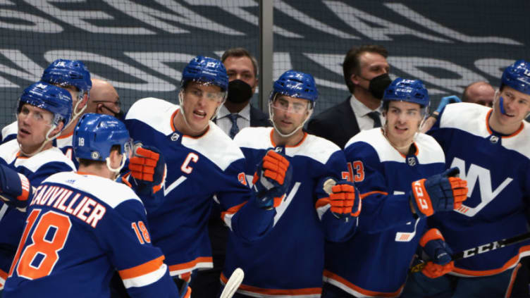 UNIONDALE, NEW YORK - MARCH 04: Skating in his 300th NHL goal, Anthony Beauvillier #18 of the New York Islanders celebrates his second period goal against Jonas Johansson #34 of the Buffalo Sabres at the Nassau Coliseum on March 04, 2021 in Uniondale, New York. (Photo by Bruce Bennett/Getty Images)