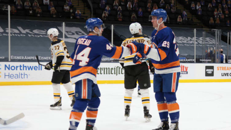 UNIONDALE, NEW YORK - MARCH 09: Brock Nelson #29 of the New York Islanders (r) celebrates his power-play goal at 16:19 of the second period against the Boston Bruins and is joined by Jean-Gabriel Pageau #44 (l) at the Nassau Coliseum on March 09, 2021 in Uniondale, New York. (Photo by Bruce Bennett/Getty Images)