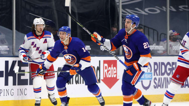 UNIONDALE, NEW YORK - APRIL 09: Kyle Palmieri #21 and Travis Zajac #14 of the New York Islanders skates against the New York Rangers at Nassau Coliseum on April 09, 2021 in Uniondale, New York. (Photo by Bruce Bennett/Getty Images)