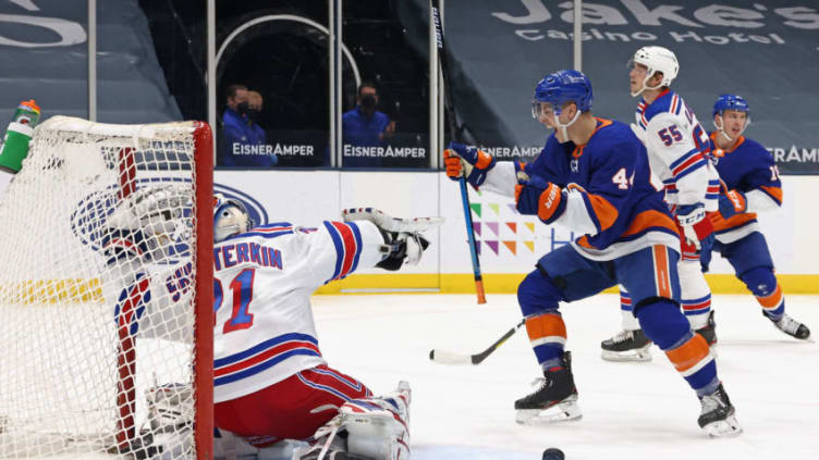 UNIONDALE, NEW YORK - APRIL 20: Jean-Gabriel Pageau #44 of the New York Islanders celebrates a second period goal by Anthony Beauvillier #18 (not shown) against Igor Shesterkin #31 of the New York Rangers at the Nassau Coliseum on April 20, 2021 in Uniondale, New York. (Photo by Bruce Bennett/Getty Images)