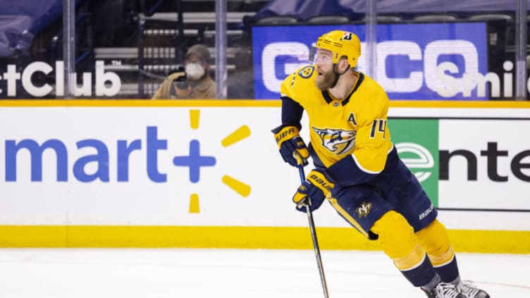 NASHVILLE, TN - APRIL 26: Mattias Ekholm #14 of the Nashville Predators skates with the puck against the Florida Panthers during the second period at Bridgestone Arena on April 26, 2021 in Nashville, Tennessee. (Photo by Brett Carlsen/Getty Images)