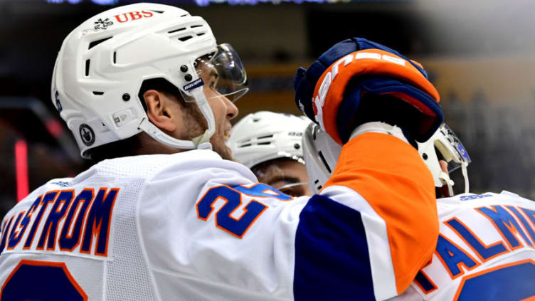 PITTSBURGH, PENNSYLVANIA - MAY 16: Oliver Wahlstrom #26 celebrates with Kyle Palmieri #21 of the New York Islanders after Palmieri's goal in the first period in Game One of the First Round of the 2021 Stanley Cup Playoffs at PPG PAINTS Arena on May 16, 2021 in Pittsburgh, Pennsylvania. (Photo by Emilee Chinn/Getty Images)