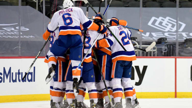 PITTSBURGH, PENNSYLVANIA - MAY 16: The New York Islanders celebrate their 4-3 win over the Pittsburgh Penguins during overtime in Game One of the First Round of the 2021 Stanley Cup Playoffs at PPG PAINTS Arena on May 16, 2021 in Pittsburgh, Pennsylvania. (Photo by Emilee Chinn/Getty Images)