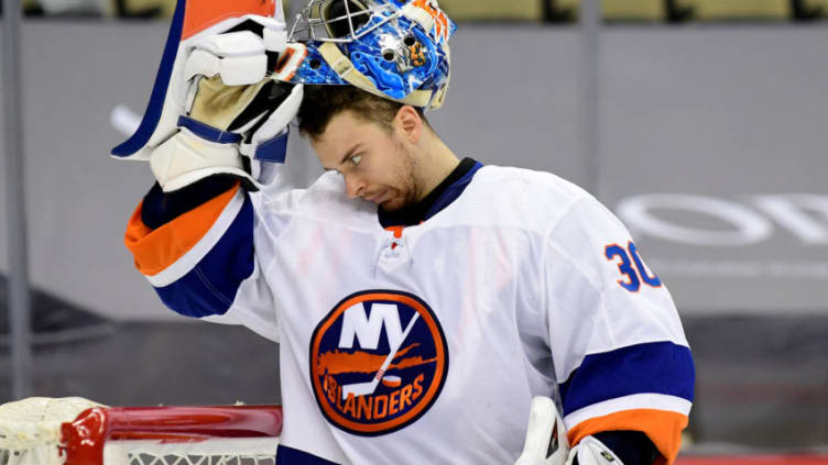 PITTSBURGH, PENNSYLVANIA - MAY 16: Ilya Sorokin #30 of the New York Islanders takes off his face mask during overtime against the Pittsburgh Penguins in Game One of the First Round of the 2021 Stanley Cup Playoffs at PPG PAINTS Arena on May 16, 2021 in Pittsburgh, Pennsylvania. (Photo by Emilee Chinn/Getty Images)