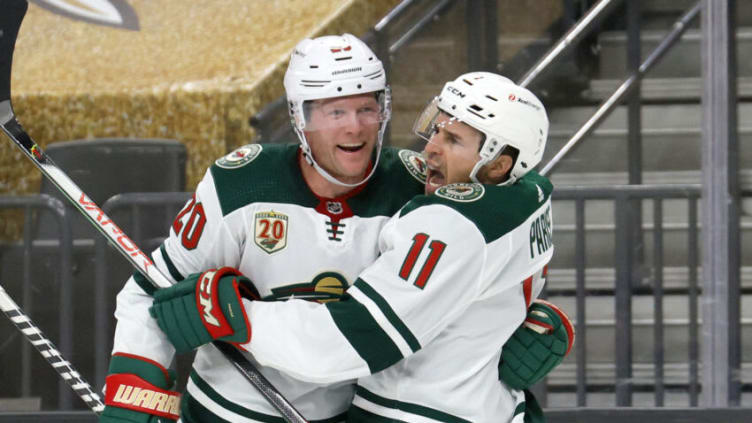 LAS VEGAS, NEVADA - MAY 28: Ryan Suter #20 and Zach Parise #11 of the Minnesota Wild celebrate after Suter assisted Parise on a first-period goal against the Vegas Golden Knights in Game Seven of the First Round of the 2021 Stanley Cup Playoffs at T-Mobile Arena on May 28, 2021 in Las Vegas, Nevada. (Photo by Ethan Miller/Getty Images)