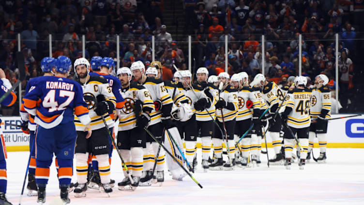 UNIONDALE, NEW YORK - JUNE 09: The Boston Bruins and the New York Islanders shake hands following the Islanders 6-2 victory in Game Six of the Second Round of the 2021 NHL Stanley Cup Playoffs at the Nassau Coliseum on June 09, 2021 in Uniondale, New York. (Photo by Bruce Bennett/Getty Images)