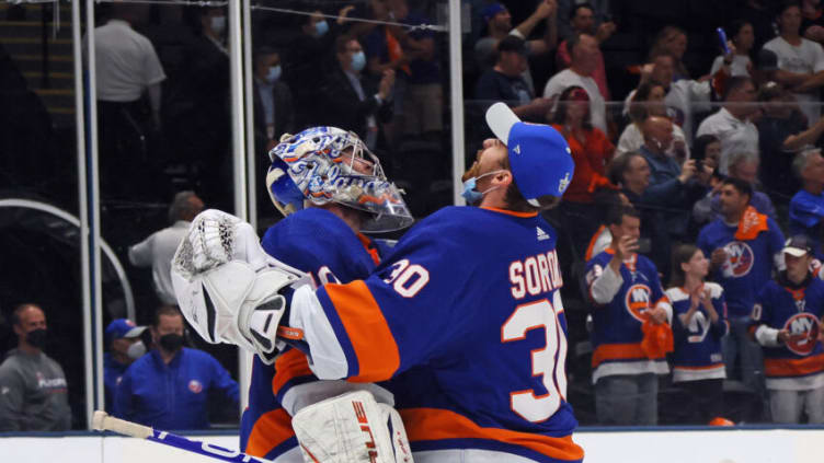 UNIONDALE, NEW YORK - JUNE 09: Semyon Varlamov #40 and Ilya Sorokin #30 of the New York Islanders celebrate a 6-2 victory over the Boston Bruins in Game Six of the Second Round of the 2021 NHL Stanley Cup Playoffs at the Nassau Coliseum on June 09, 2021 in Uniondale, New York. (Photo by Bruce Bennett/Getty Images)