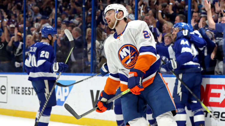 TAMPA, FLORIDA - JUNE 21: Scott Mayfield #24 of the New York Islanders reacts to a goal by Yanni Gourde #37 of the Tampa Bay Lightning during the first period in Game Five of the Stanley Cup Semifinals during the 2021 Stanley Cup Playoffs at Amalie Arena on June 21, 2021 in Tampa, Florida. (Photo by Mike Carlson/Getty Images)