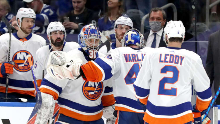 TAMPA, FLORIDA - JUNE 21: Semyon Varlamov #40 of the New York Islanders is replaced by Ilya Sorokin #30 during the first period against the Tampa Bay Lightning in Game Five of the Stanley Cup Semifinals during the 2021 Stanley Cup Playoffs at Amalie Arena on June 21, 2021 in Tampa, Florida. (Photo by Mike Carlson/Getty Images)