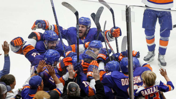 UNIONDALE, NEW YORK - JUNE 23: The New York Islanders celebrate after their 3-2 overtime victory against the Tampa Bay Lightning in Game Six of the Stanley Cup Semifinals during the 2021 Stanley Cup Playoffs at Nassau Coliseum on June 23, 2021 in Uniondale, New York. (Photo by Sarah Stier/Getty Images)