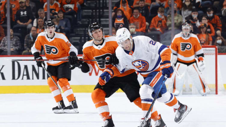 PHILADELPHIA, PENNSYLVANIA - SEPTEMBER 28: Oliver Wahlstrom #26 of the New York Islanders tries to skate past Tyson Foerster #52 of the Philadelphia Flyers during the second period at Wells Fargo Center on September 28, 2021 in Philadelphia, Pennsylvania. (Photo by Tim Nwachukwu/Getty Images)