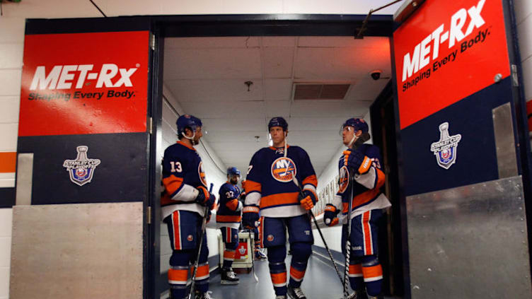 UNIONDALE, NY - MAY 07: (L-R) Colin McDonald #13, Matt Martin #17 and Casey Cizikas #53 of the New York Islanders walk out for warmups prior to the game against the Pittsburgh Penguins in Game Four of the Eastern Conference Quarterfinals during the 2013 NHL Stanley Cup Playoffs at the Nassau Veterans Memorial Coliseum on May 7, 2013 in Uniondale, New York. (Photo by Bruce Bennett/Getty Images)