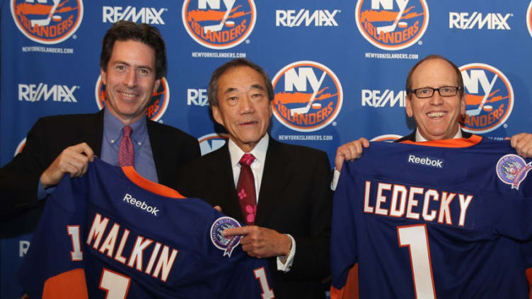 UNIONDALE, NY - OCTOBER 22: (l-r) New York Islanders partners Scott Malkin, Charles Wang and Jon Ledecky pose for a photo opportunity during a press conference at Nassau Coliseum on October 22, 2014 in Uniondale, New York. (Photo by Bruce Bennett/Getty Images)