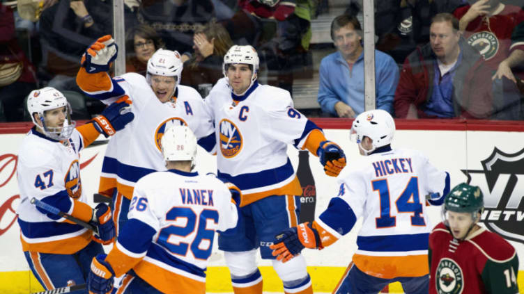 ST PAUL, MN - DECEMBER 29: (L-R) Andrew MacDonald #47, Kyle Okposo #21, Thomas Vanek #26, John Tavares #91 and Thomas Hickey #14 of the New York Islanders celebrate a goal by Okposo against the Minnesota Wild during the game on December 29, 2013 at Xcel Energy Center in St Paul, Minnesota. The Islanders defeated 5-4. (Photo by Hannah Foslien/Getty Images)