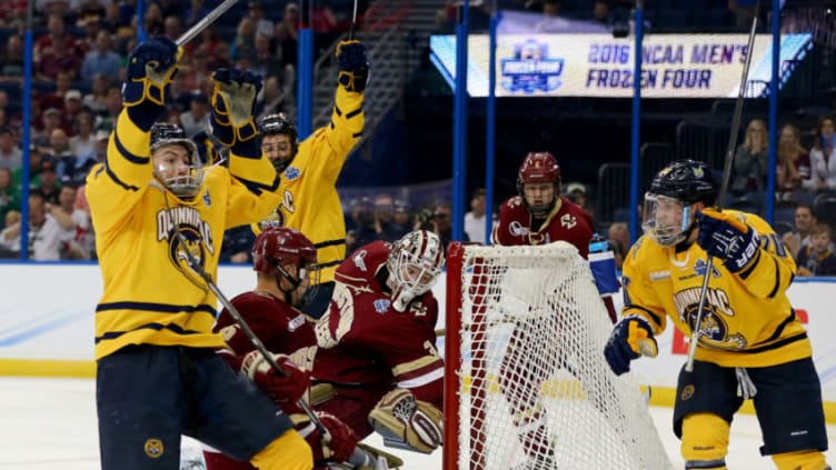 TAMPA, FLORIDA - APRIL 07: Landon Smith #16 of the Quinnipiac Bobcats celebrates his goal with teammate Travis St. Denis #26 as Thatcher Demko #30 of the Boston College Eagles is unable to stop the puck in the second period during semifinals of the 2016 NCAA Division I Men's Hockey Championships at Amalie Arena on April 7, 2016 in Tampa, Florida. (Photo by Elsa/Getty Images)