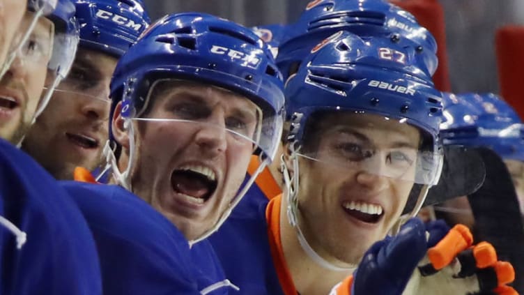 NEW YORK, NY - DECEMBER 06: (L-R) Casey Cizikas #53 and Anders Lee #27 of the New York Islanders celebrate a goal against the New York Rangers at the Barclays Center on December 6, 2016 in the Brooklyn borough of New York City. the Islanders defeated the Rangers 4-2. (Photo by Bruce Bennett/Getty Images)