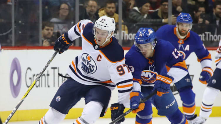 NEW YORK, NY - NOVEMBER 07: Connor McDavid #97 of the Edmonton Oilers and Mathew Barzal #13 of the New York Islanders battle for the puck during the first period at the Barclays Center on November 7, 2017 in the Brooklyn borough of New York City. (Photo by Bruce Bennett/Getty Images)