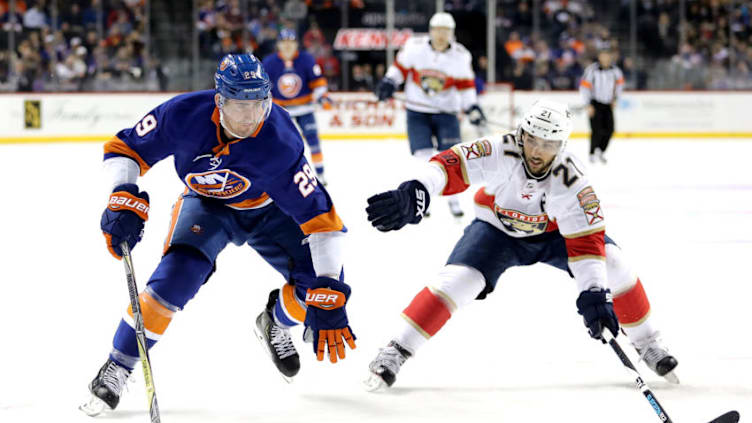 NEW YORK, NY - MARCH 26: Brock Nelson #29 of the New York Islanders skates with the puck against Vincent Trocheck #21 of the Florida Panthers in the second period during their game at Barclays Center on March 26, 2018 in the Brooklyn borough of New York City. (Photo by Abbie Parr/Getty Images)