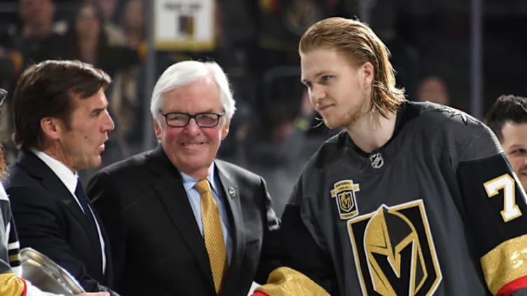 LAS VEGAS, NV - MARCH 31: (L-R) Vegas Golden Knights general manager George McPhee and Chairman, CEO and Governor Bill Foley present William Karlsson #71 with the Vegas Golden Knights Seventh Player Award, given to the player whose performance most exceeded fan expectations this season, after the team's 3-2 win over the San Jose Sharks in their final regular-season home game at T-Mobile Arena on March 31, 2018 in Las Vegas, Nevada. The victory clinched the Pacific Division title for the Golden Knights. (Photo by Ethan Miller/Getty Images)