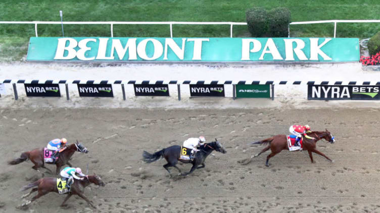 ELMONT, NY - JUNE 09: Justify #1, ridden by jockey Mike Smith crosses the finish line to win the 150th running of the Belmont Stakes at Belmont Park on June 9, 2018 in Elmont, New York. Justify becomes the thirteenth Triple Crown winner and the first since American Pharoah in 2015. (Photo by Al Bello/Getty Images)
