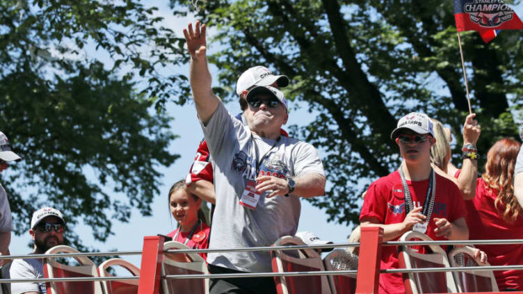 WASHINGTON, DC - JUNE 12: Head coach Barry Trotz of the NHL Stanley Cup champion Washington Capitals tosses a strand of beads during a victory parade on June 12, 2018 in Washington, DC. (Photo by Alex Brandon - Pool/Getty Images)