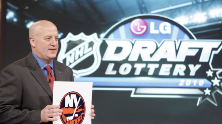 Deputy Commissioner of the NHL Bill Daly announces the fifth pick to go to the New York Islanders (Photo by Abelimages / Getty Images for NHL)