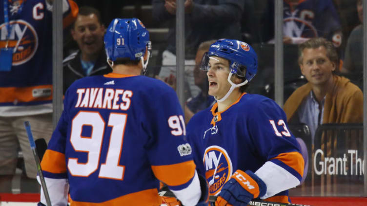 NEW YORK, NY - SEPTEMBER 25: Mathew Barzal #13 (R) of the New York Islanders celebrates his powerplay goal at 14:15 of the first period against the New Jersey Devils and is joined by John Tavares #91 (L) during a preseason game at the Barclays Center on September 25, 2017 in the Brooklyn borough of New York City. (Photo by Bruce Bennett/Getty Images)