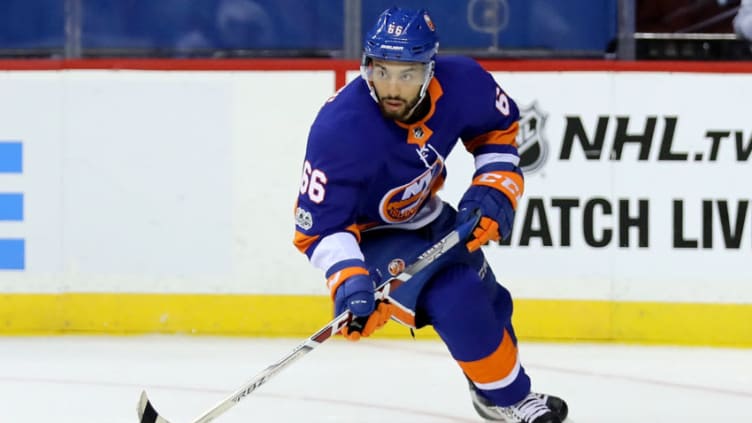 NEW YORK, NY - OCTOBER 07: Joshua Ho-Sang #66 of the New York Islanders passes the puck against the Buffalo Sabres in the first period at Barclays Center on October 7, 2017 in the Brooklyn Borough of New York City. (Photo by Abbie Parr/Getty Images)