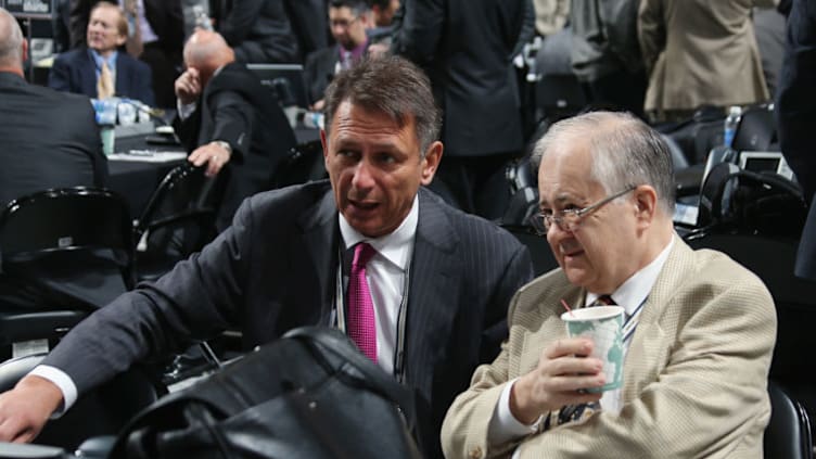 PITTSBURGH, PA - JUNE 23: Detroit Red Wings General Manager Ken Holland (L) and Detroit Red Wings Senior Vice President Jim Devellano speak during day two of the 2012 NHL Entry Draft at Consol Energy Center on June 23, 2012 in Pittsburgh, Pennsylvania. (Photo by Bruce Bennett/Getty Images)